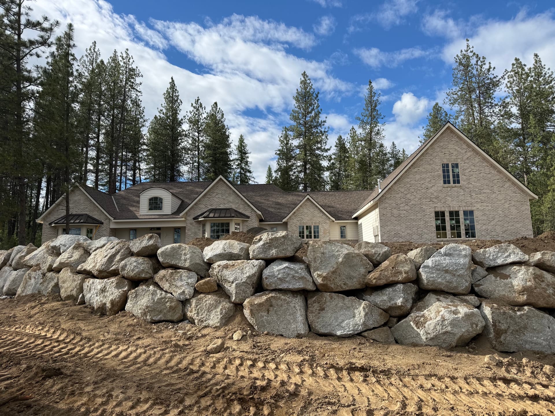 Boulder Wall Built to Hold a Roundabout Driveway image